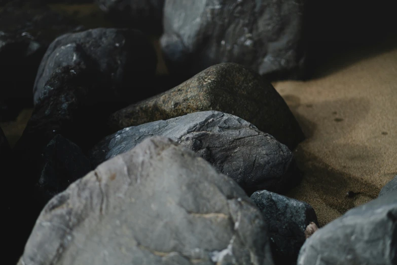 many rocks on the ground near each other