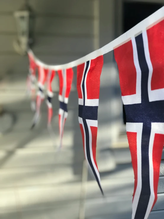 flags with a bunt on a house's front porch