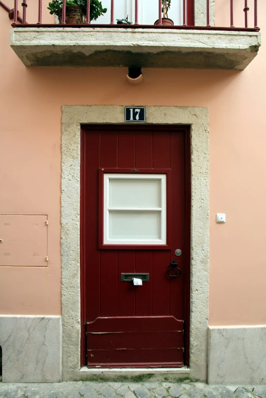 a doorway that has a red door on it