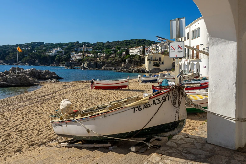 the boat is sitting on the beach and ready for people to use it