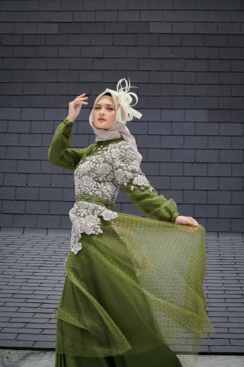  in traditional costume posing for camera
