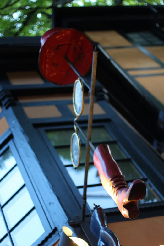 two items hanging from poles near each other on a wall