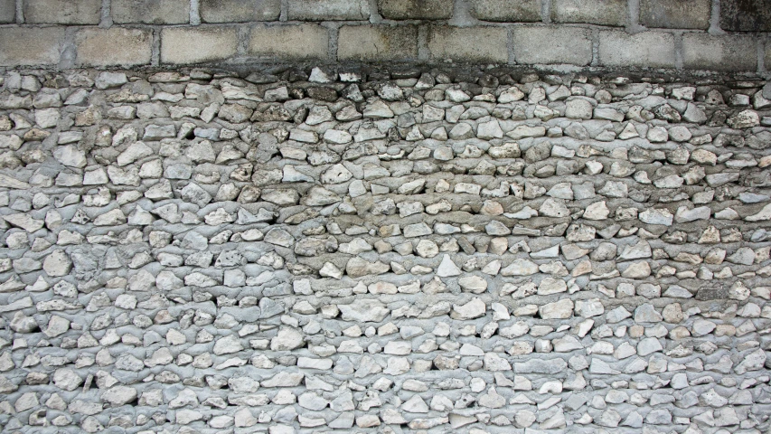 large bricks are arranged together on the wall