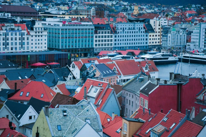 a city is shown with boats docked in the water