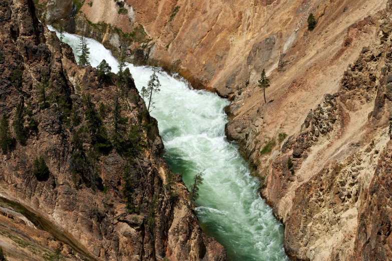 aerial po of flowing water in canyon area