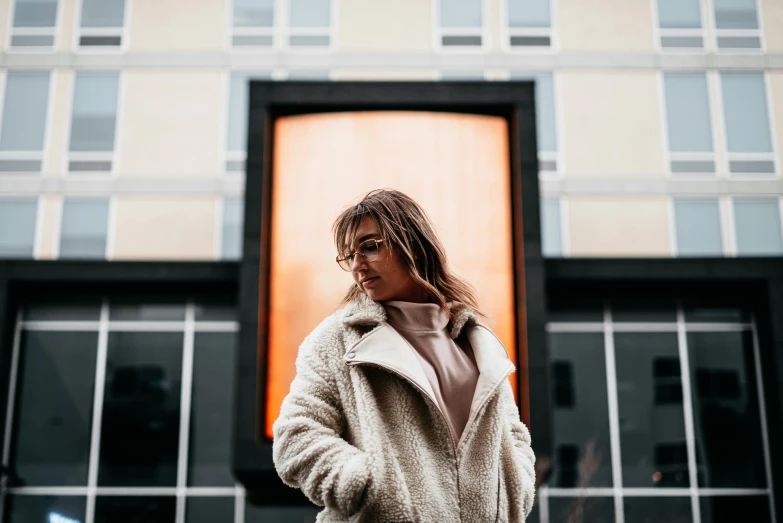 a person standing outside wearing a coat