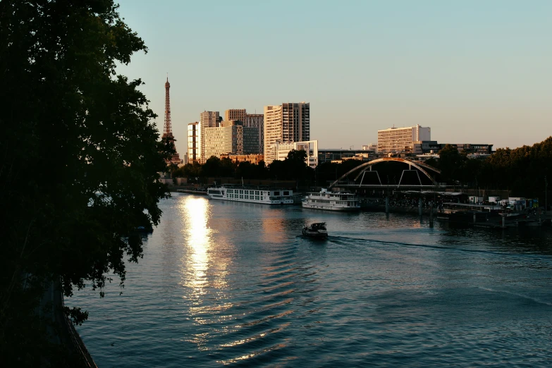 a view of boats and the lights of a city