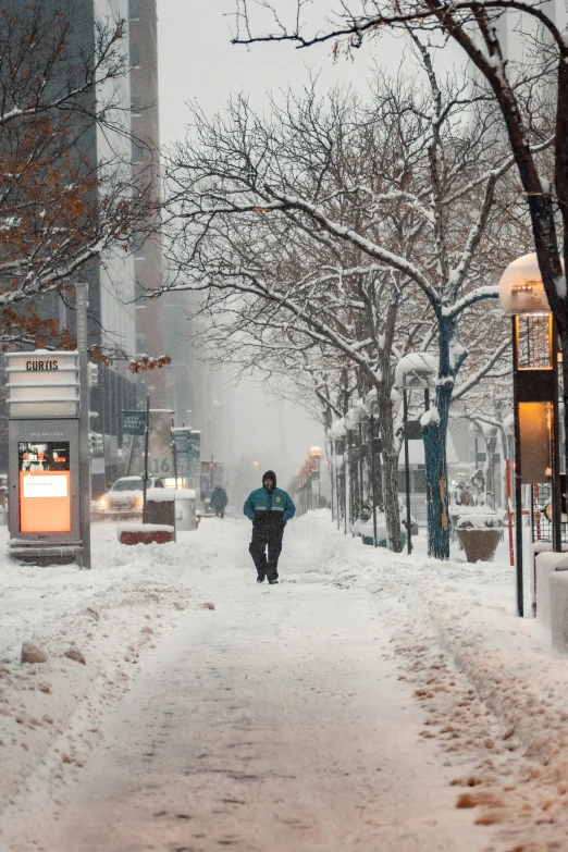 a person walking down a snowy street