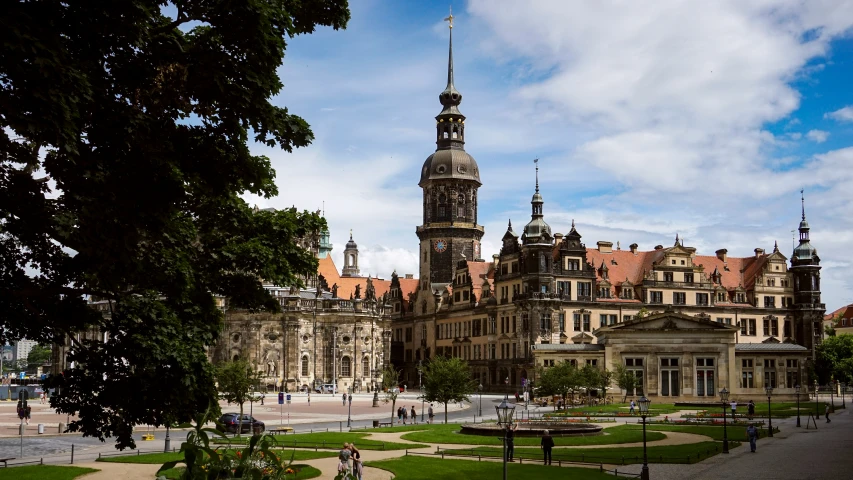 a huge building that is very old, with a clock tower