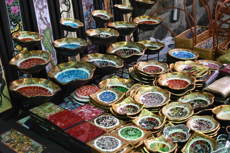 plates displayed in front of metal racks with pictures on them