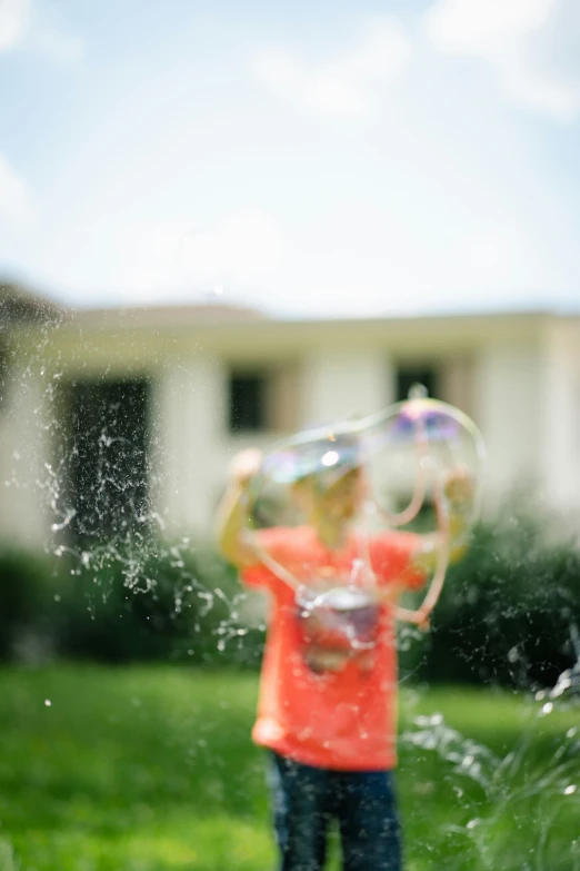 this is a picture of a girl playing with bubbles