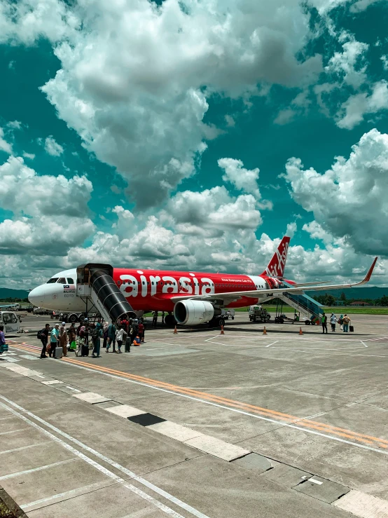 a group of people waiting to board the airplane