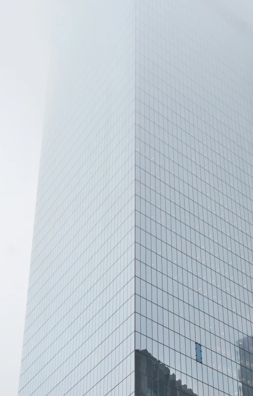 an unusual building with mirrors on the side of it