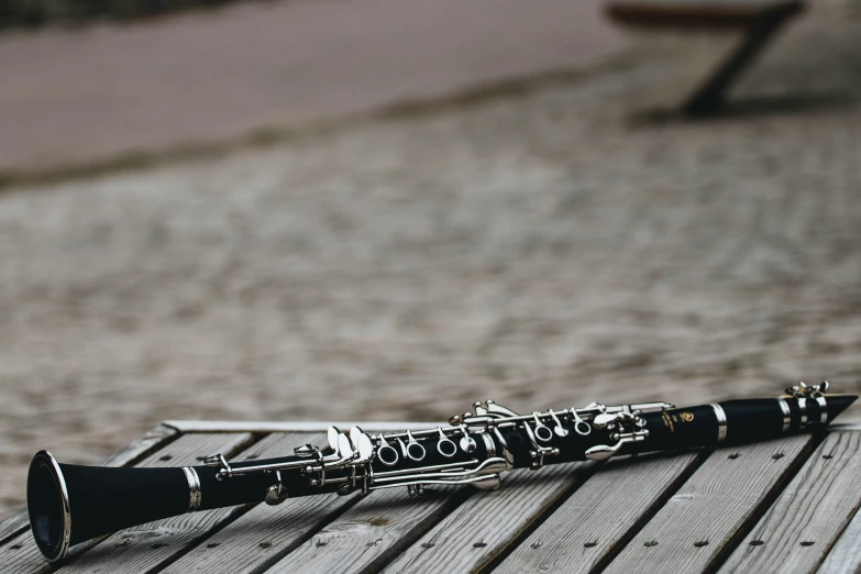 a flute on a table in front of a bench