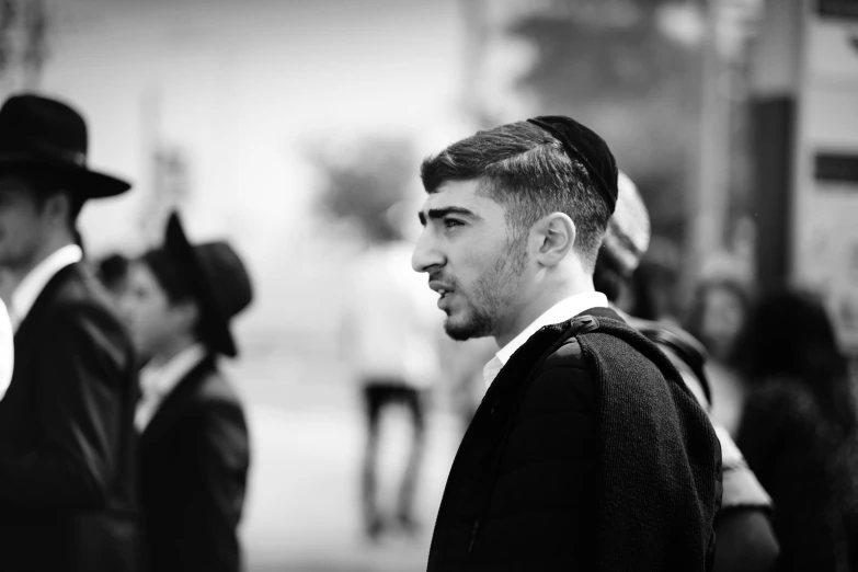 black and white pograph of some men wearing hats