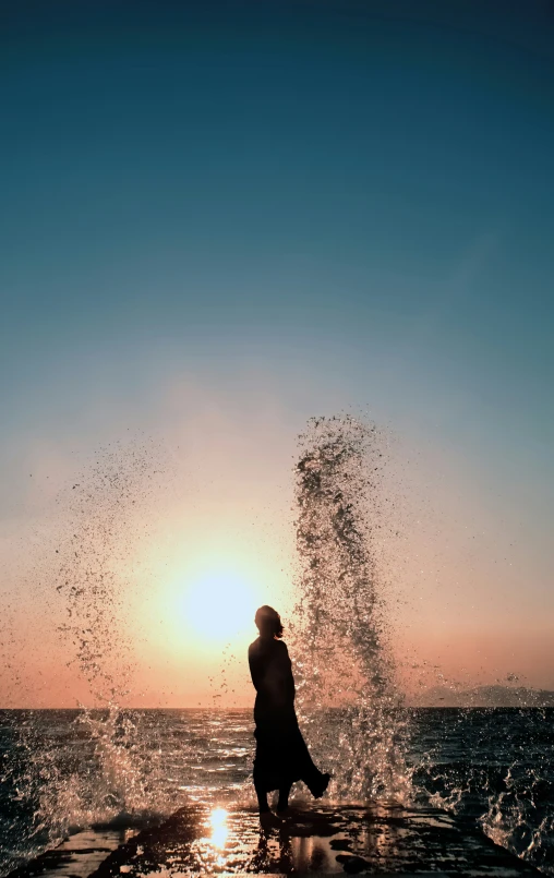 someone standing on a pier near the water