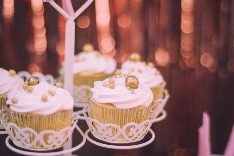 some cupcakes are on a cake stand