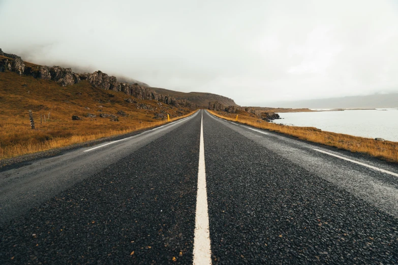 a po of an open road overlooking the ocean