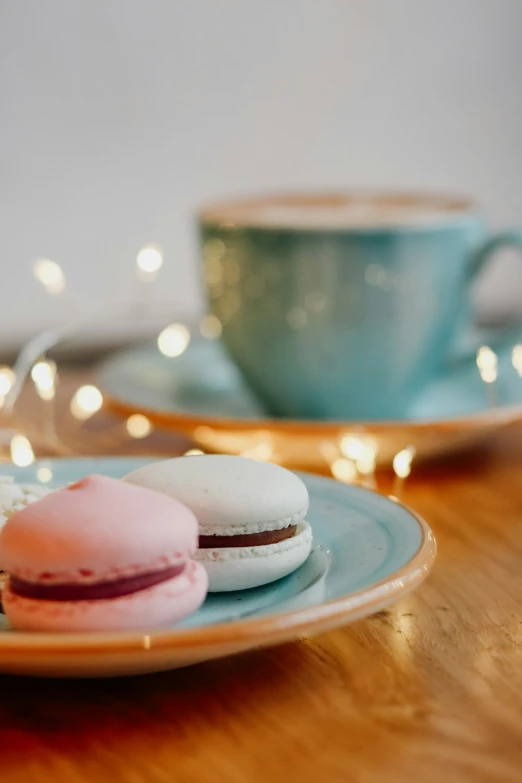 a couple of blue plates with a few frosted pastries