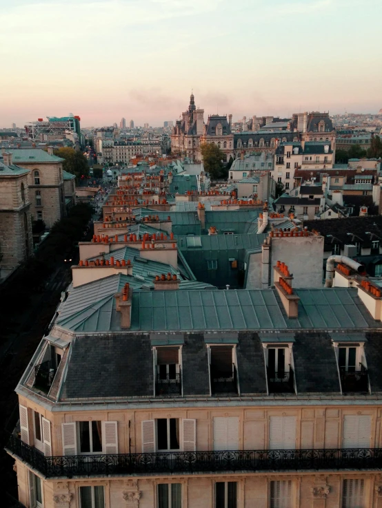 a picture of roofs and buildings with the sky visible