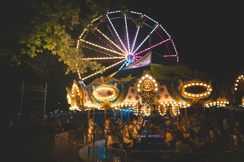 people on a carnival ride at night