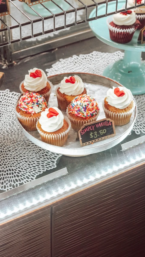 there are many cup cakes on this table