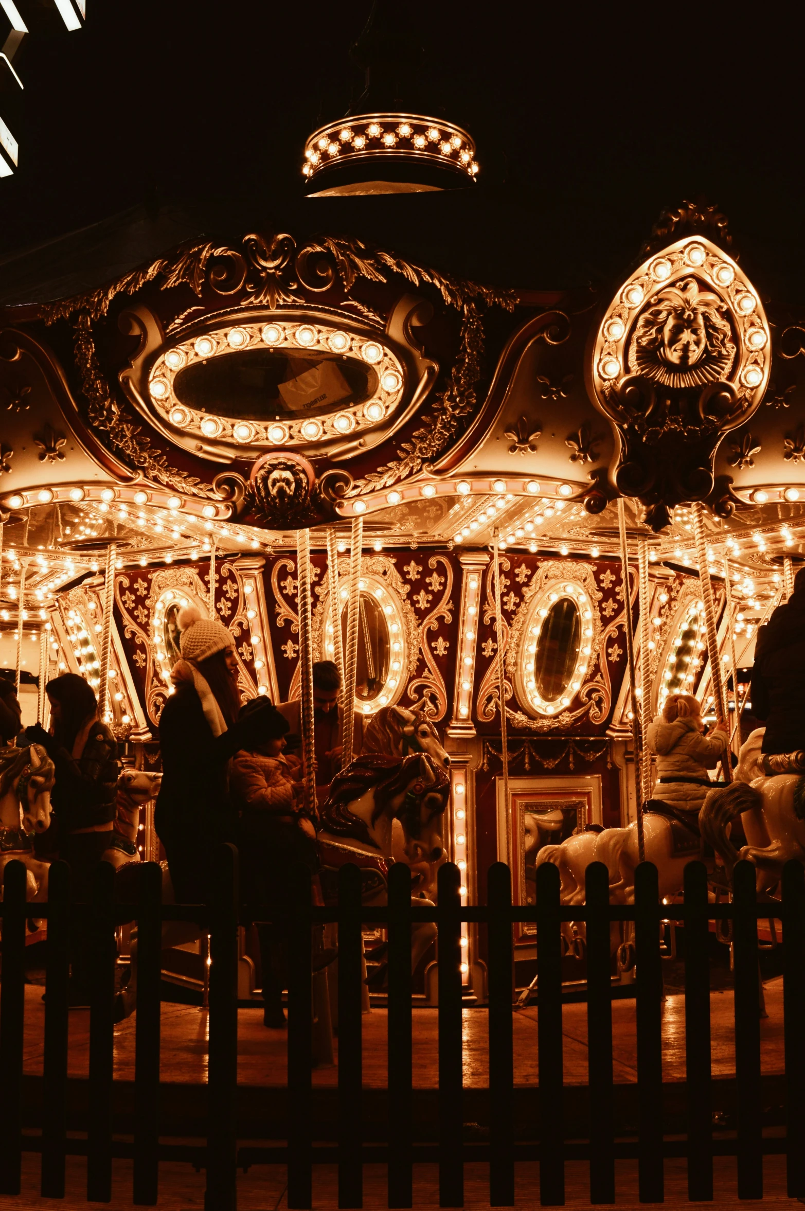 there is a fairground at night and it looks beautiful