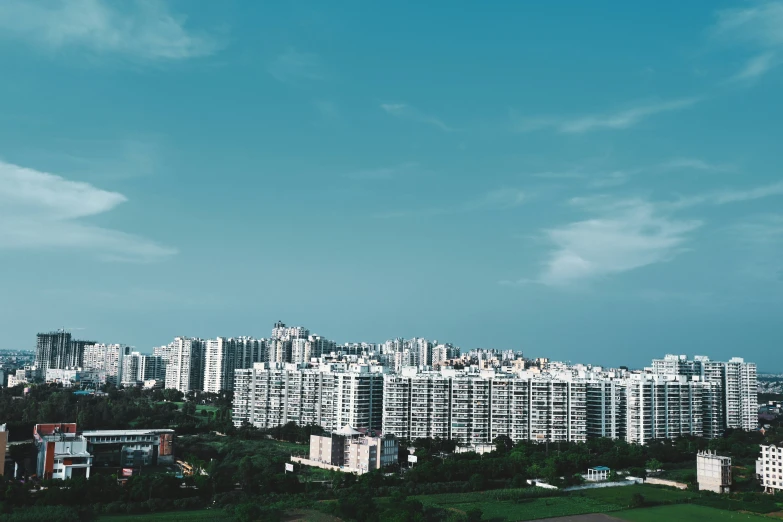 a tall city with some white buildings on top