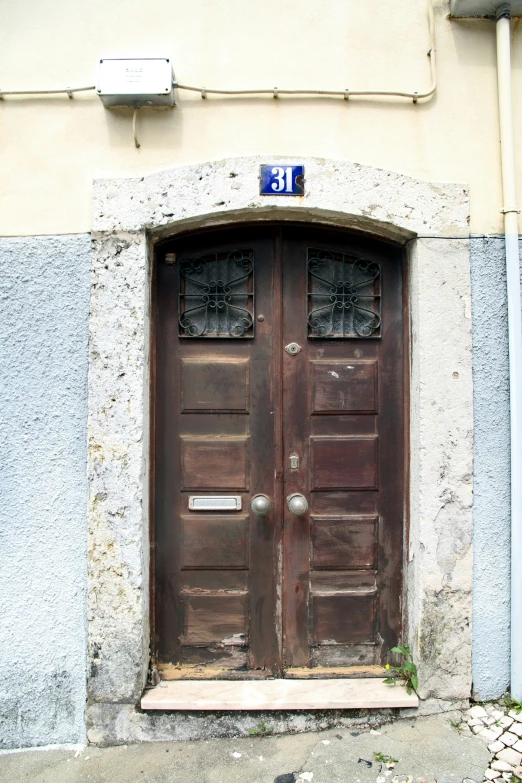 two doors are open on the outside of a building