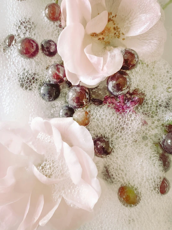 some flowers and beads sitting on a table