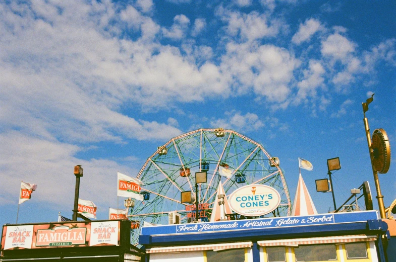 an amut park with a ferris wheel and other things