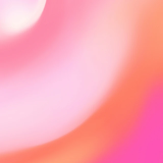 a blurry image of an orange yellow pink and purple substance