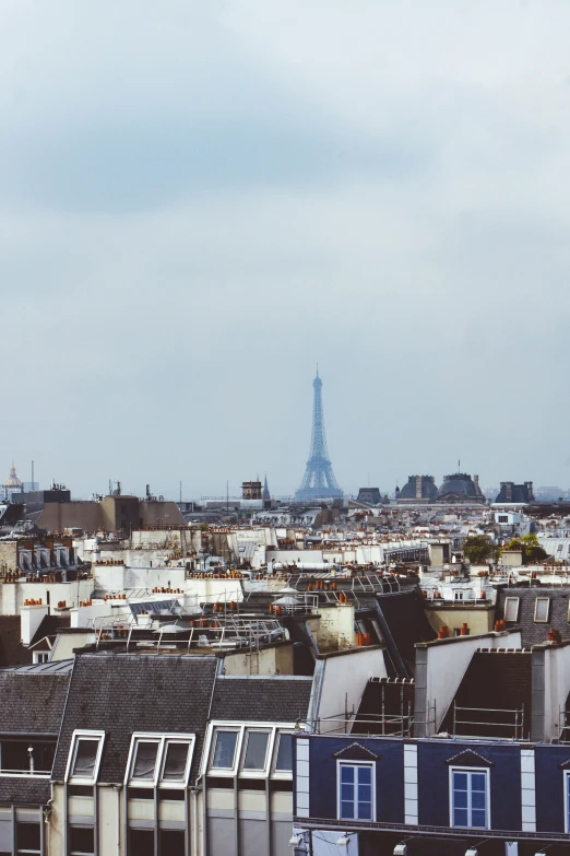 a city skyline with a very tall building in the background