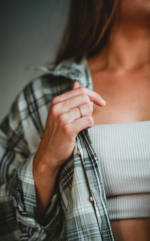 the woman is holding a piece of cloth in her hand