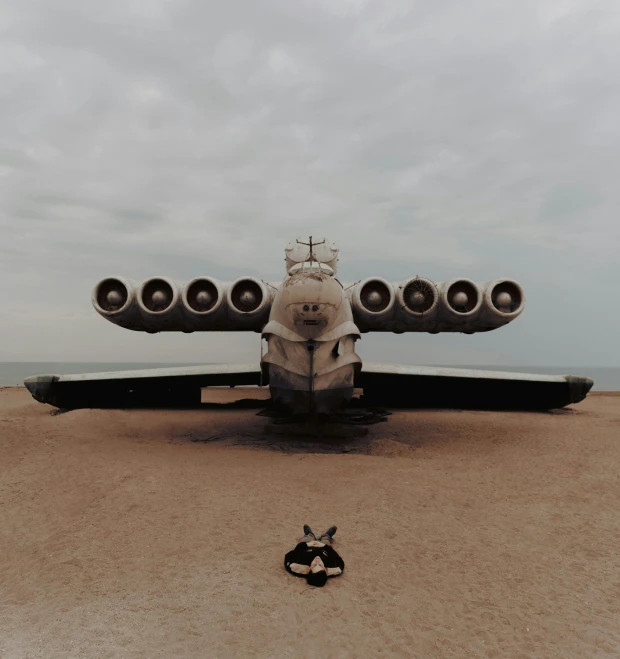 an old airplane is sitting in the desert