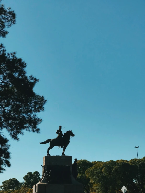 a statue on top of a horse is on display