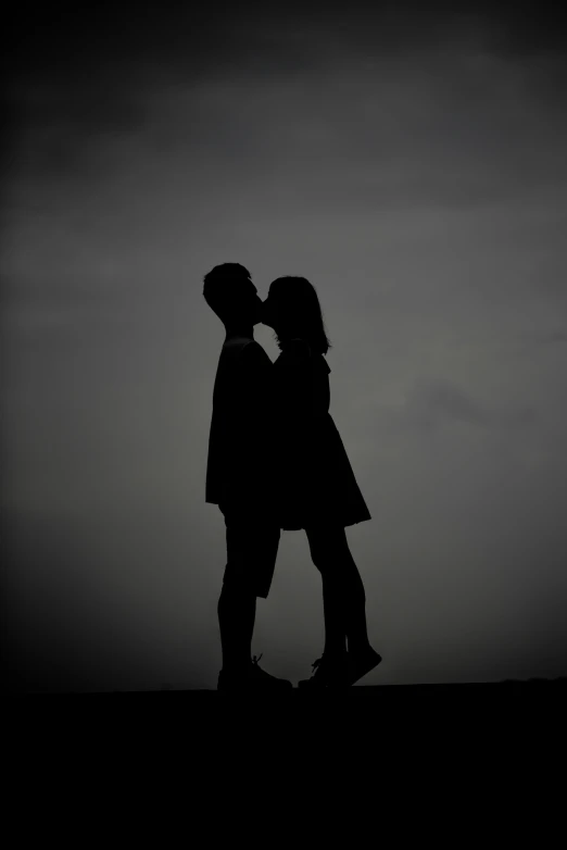 black and white image of two people in silhouette