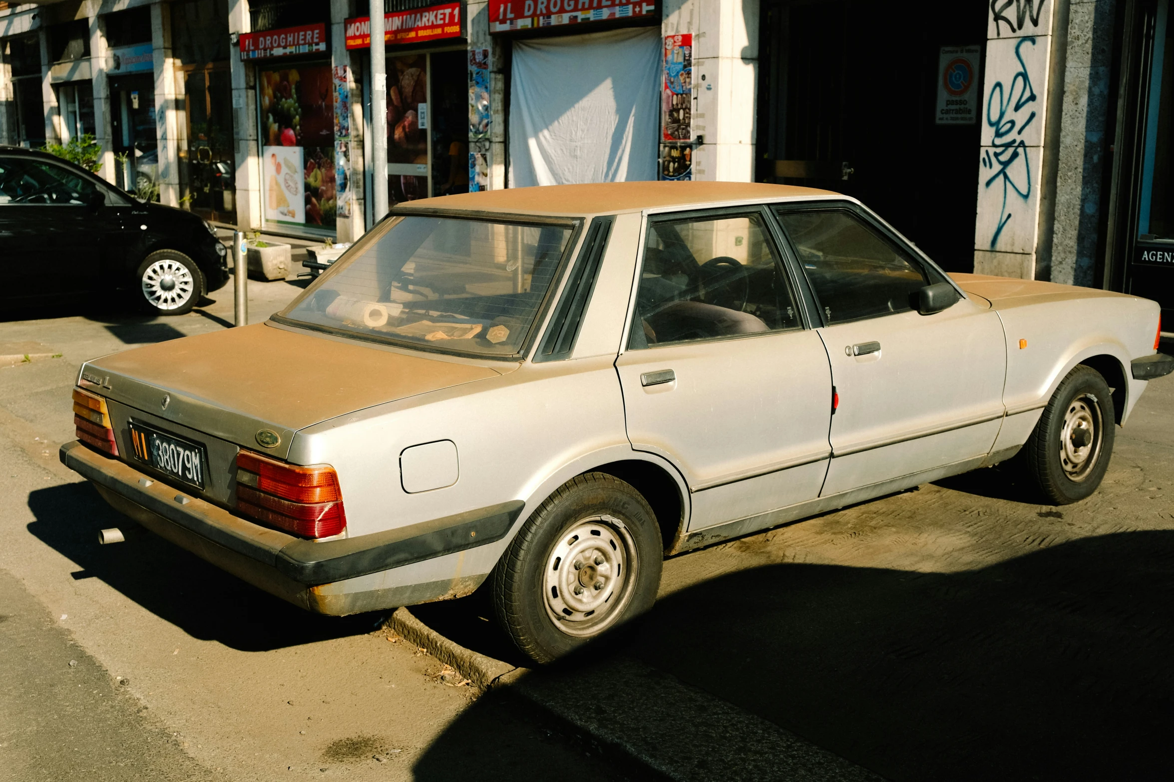 a car parked on the side of a city street