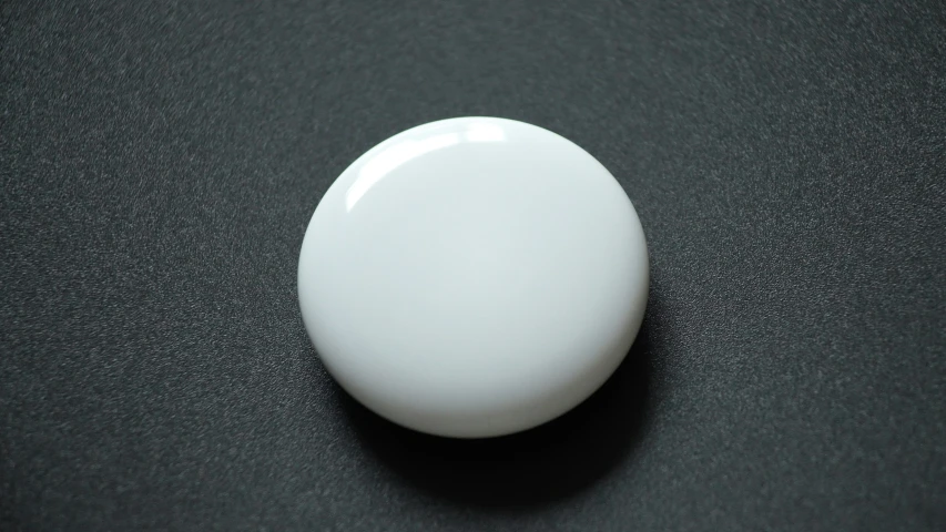 the top view of a round object with small white tips on it