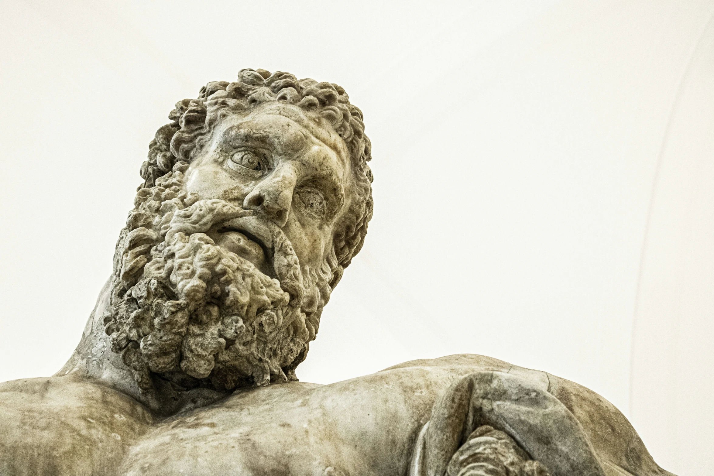 there is a statue of an ancient man with beard