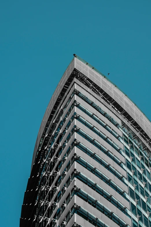 an airplane flying over a very tall building