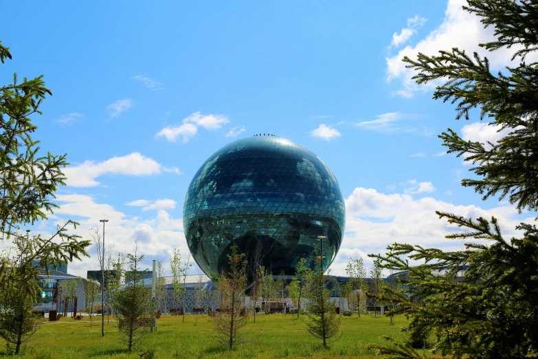 a large round object sitting in the middle of a field