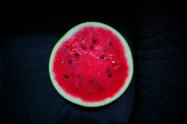 a slice of watermelon with small holes on the top