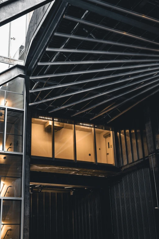 a structure with metal bars and lights on the ceiling