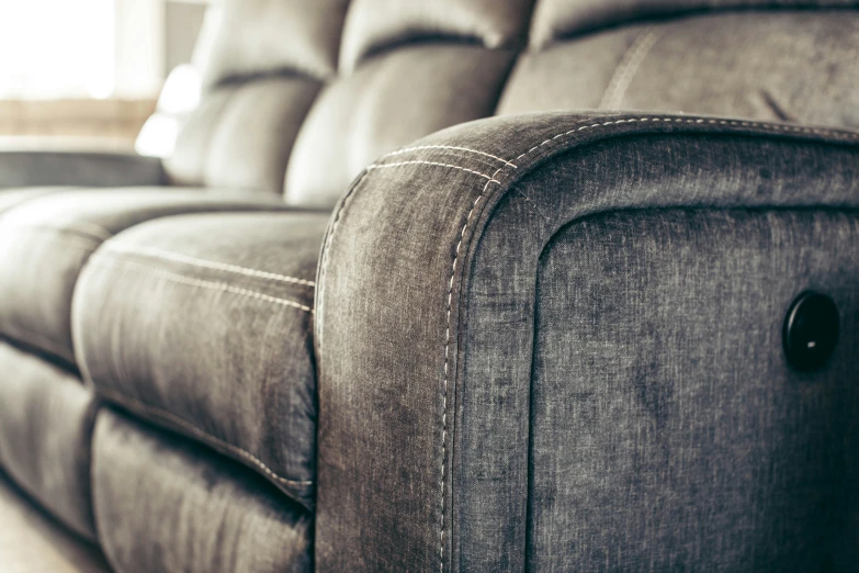 a close up s of the back of a reclining sofa