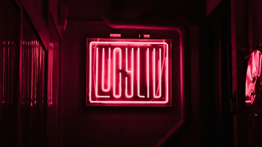 a neon sign with words written on it