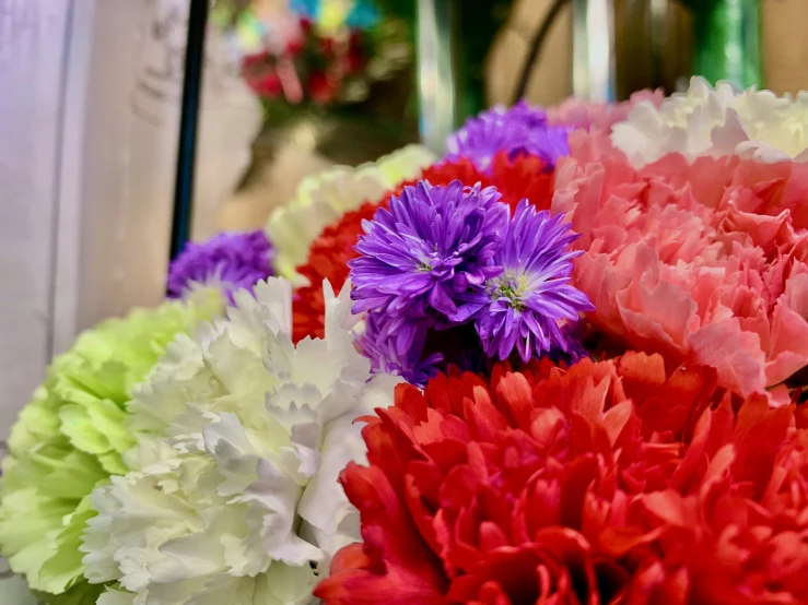 a bunch of flowers that are laying on a table