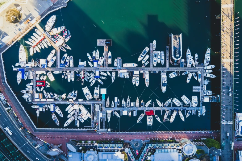 the marina with various boats is located in an aerial view