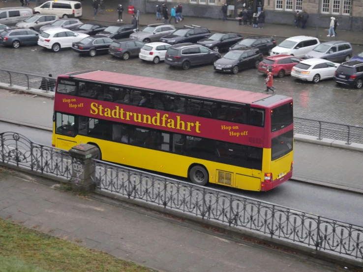 a double decker bus is traveling down the street