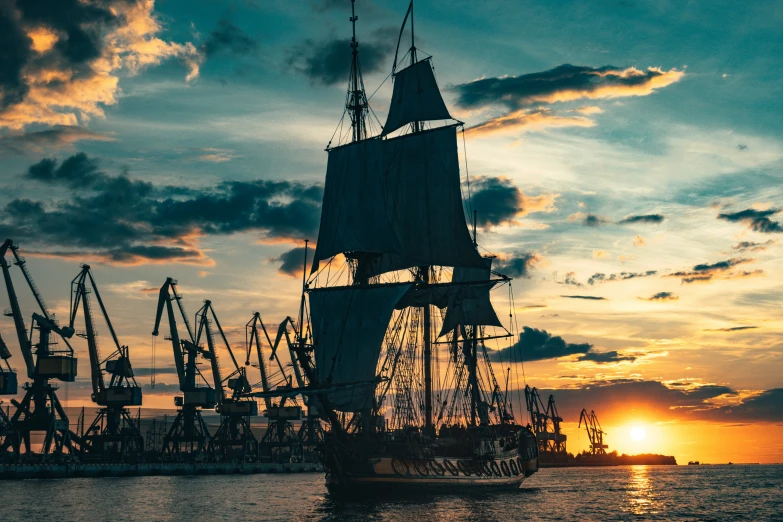 a tall sailboat sits in the middle of a harbor